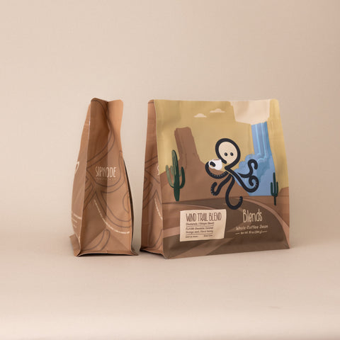 Front and side view of Wind Trail Blend medium roast whole bean coffee blend