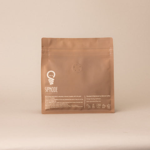 Back of Sipnode whole bean coffee blend bag with brewing guide and brand information