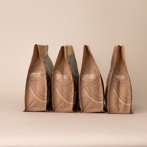 Side view of Sipnode whole bean blend coffee bags