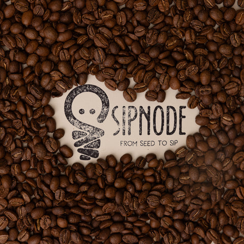 Sipnode logo surrounded by fresh roasted whole coffee beans